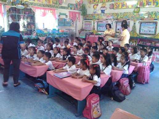 Ms. Mactal, telling story to pupils in Turo Elementary School