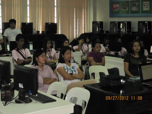 CBA Dean Balboa with faculty and students attentively listening to the Speaker...