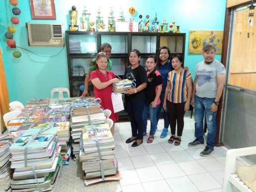 Turn over of book donations to  Ms. Lannie  C. Guevara, Registrar of LNHS Library, Bocaue with Ms. Avila, Pengson and Canete.