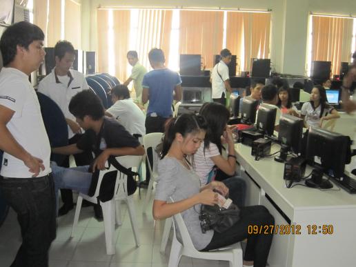 Mr. Gervacio, Maritime Librarian, assisting the CS and IT students...